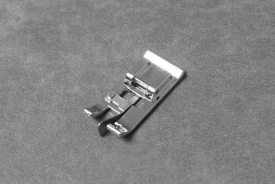 Лапка для шитья по краю и в стык - изображение